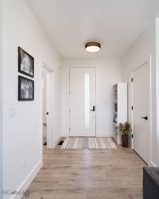 Entry with coat closet and Powder Bath