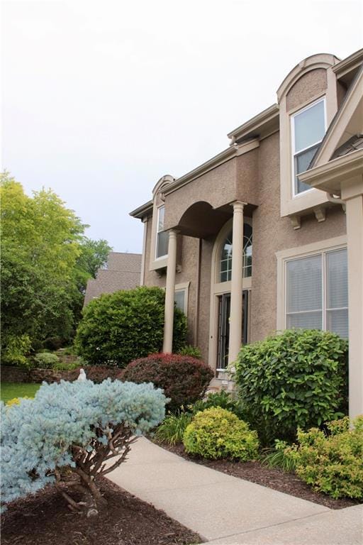 Entrance to property featuring stucco siding