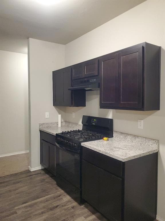 Kitchen with under cabinet range hood, dark wood-t
