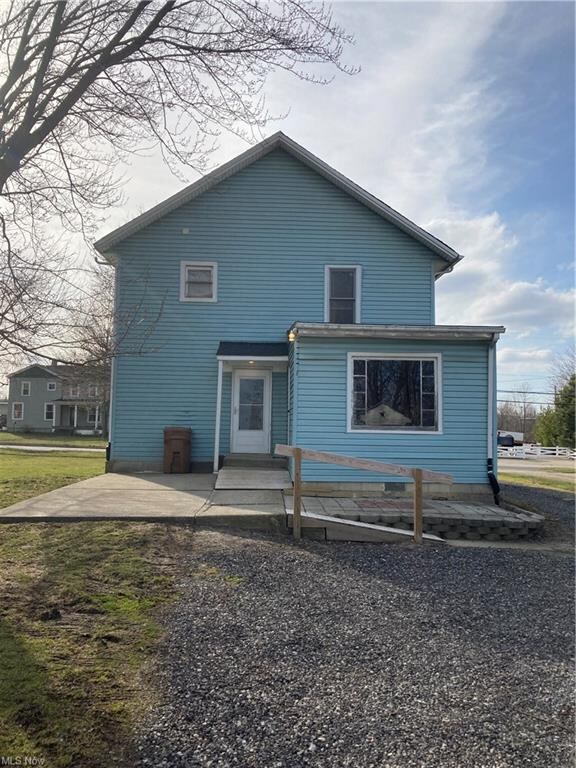 The rear view of the home shows the ramps leading 