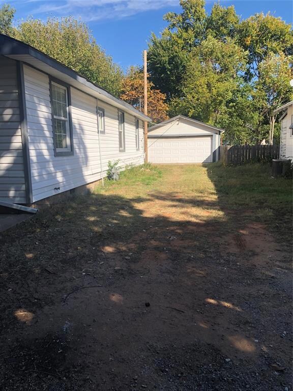 Detached 2-car garage also has workshop behind it