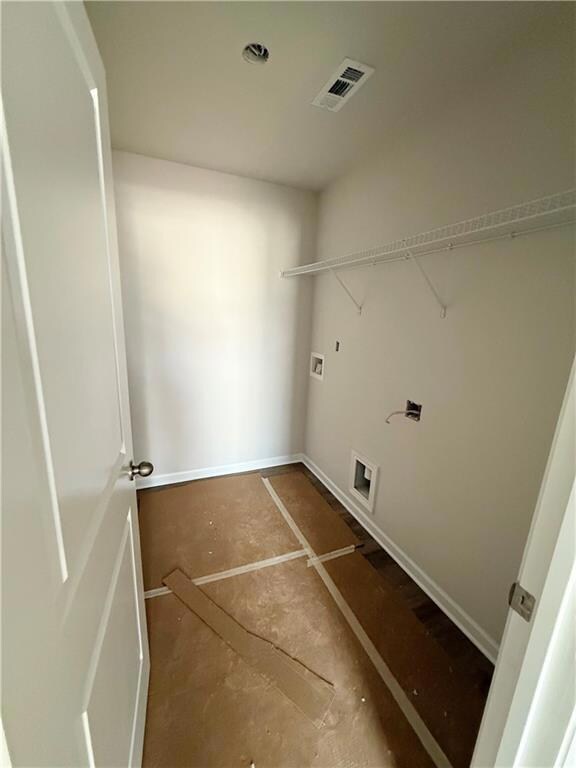 Laundry room featuring visible vents, washer hookup, and laundry area