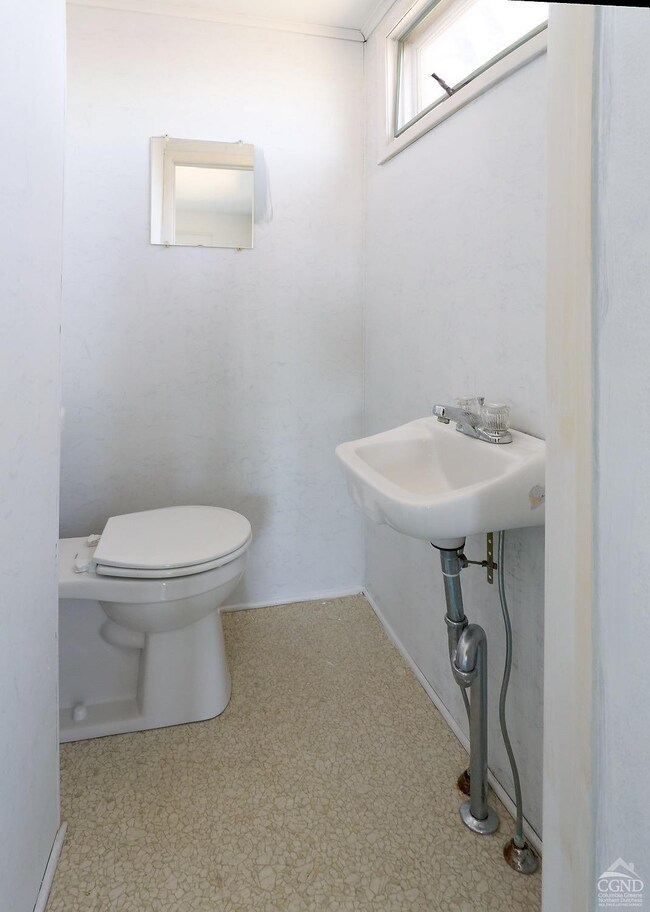 The powder room is off the living room.