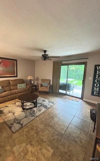 Tiled living room featuring a textured ceiling and ceiling fan