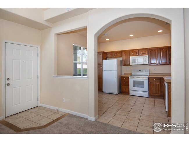 Kitchen/Dining Area. Front Entry Door on Right.
