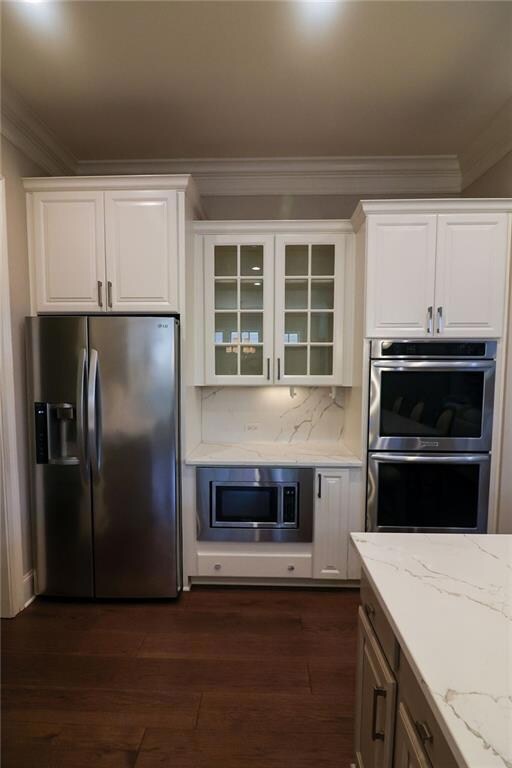 Updated kitchen features glass cabinet doors for displaying your favorite things.
