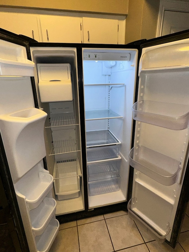 Refrigerator With Water and Ice Dispenser In The D
