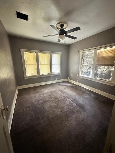 Carpeted spare room featuring healthy amount of na