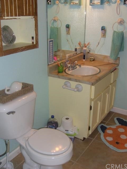 Guest Bathroom with ceramic tile and vanity.