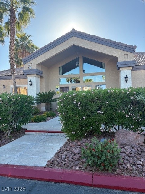 View of front of house featuring stucco siding and