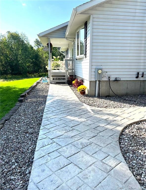 Stamped concrete to breezeway & front porch.