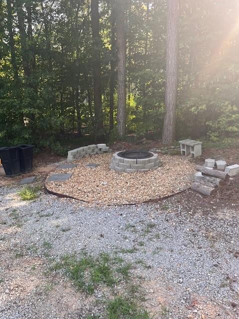 View of yard with a fire pit