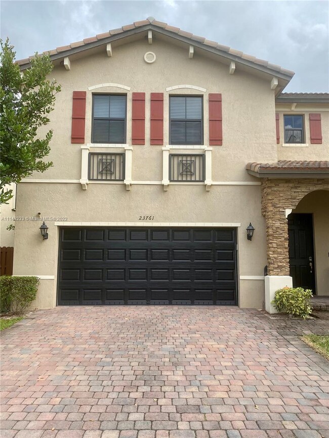 front view of home, double garage with electric mo