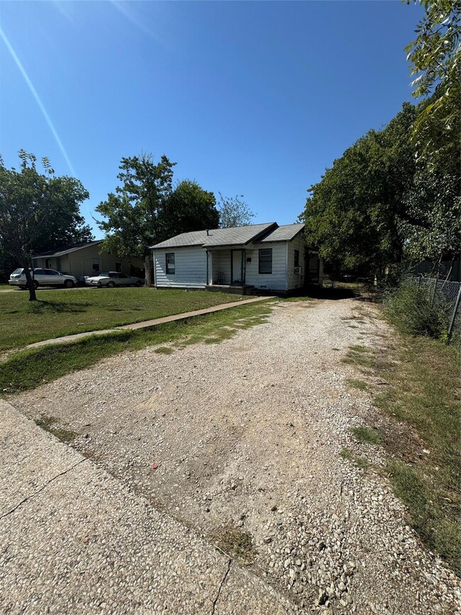 View of front of property with a front yard