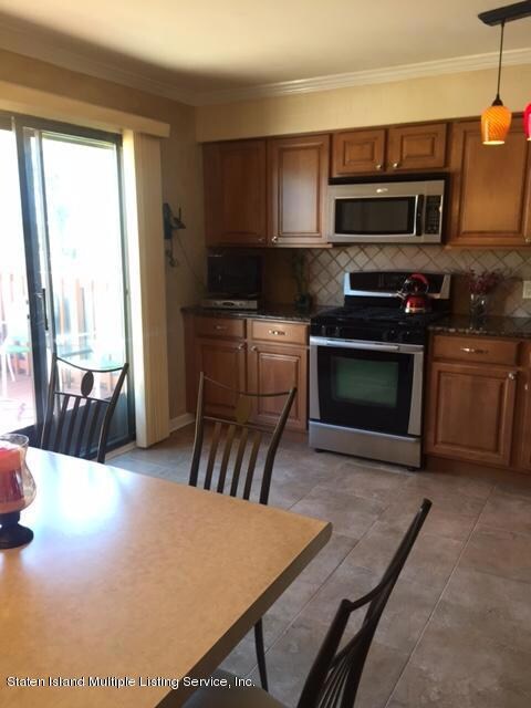 Kitchen w/ sliders to deck