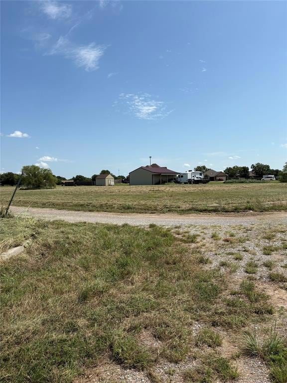 View of yard with a view of countryside