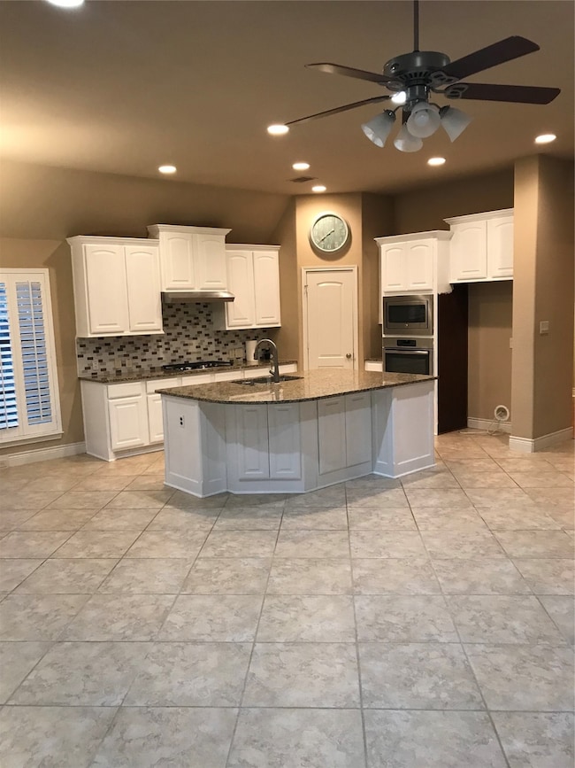 Refrigerator will be added.  Home flooring is all tile and laminate.