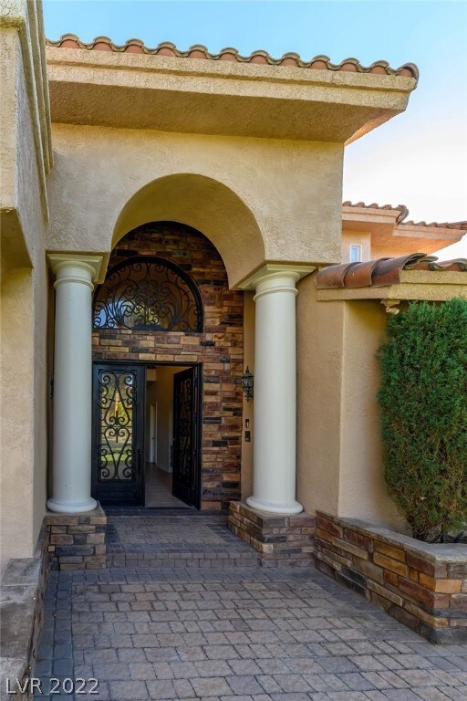 Custom Wrought iron and Glass double doors are tim