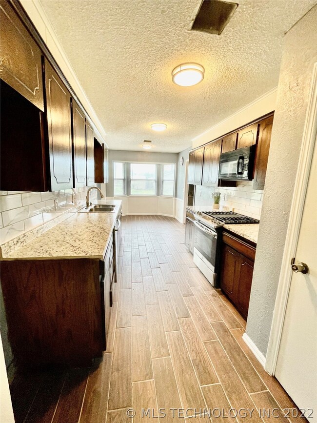 Convenient Kitchen Layout with Additional Pantry