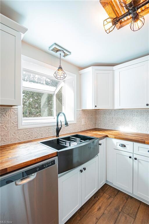 window above sink overlooks backyard