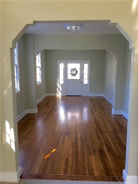 Dining room and living room with original hardwood