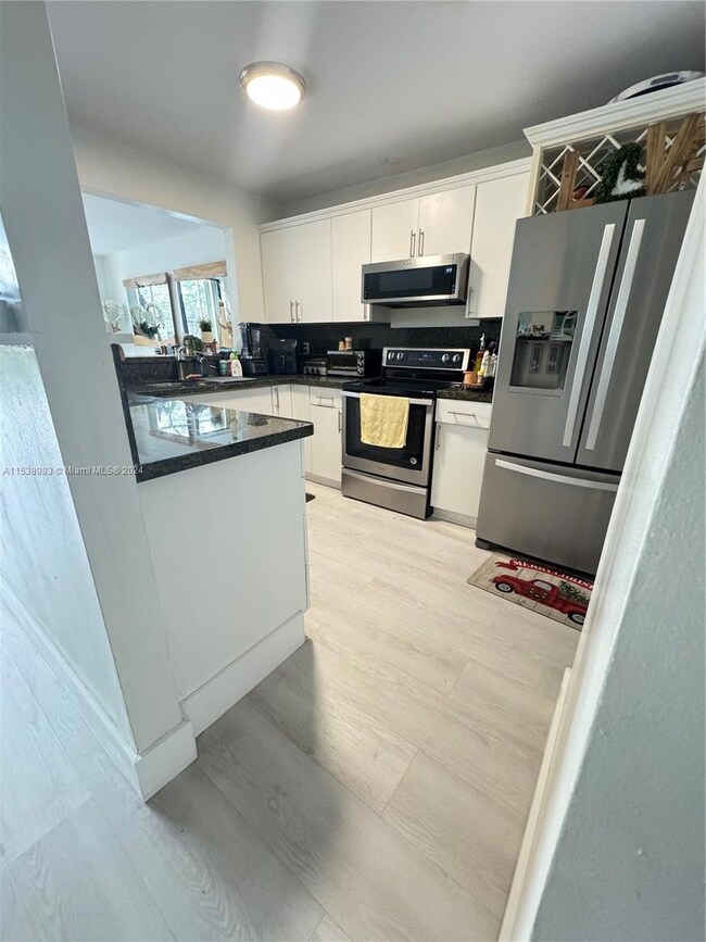 9927 Costa Del Sol Blvd unit D107, Doral, FL 33178 - photo 2