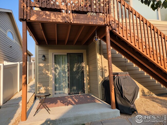 Backyard- covered patio below. Deck above