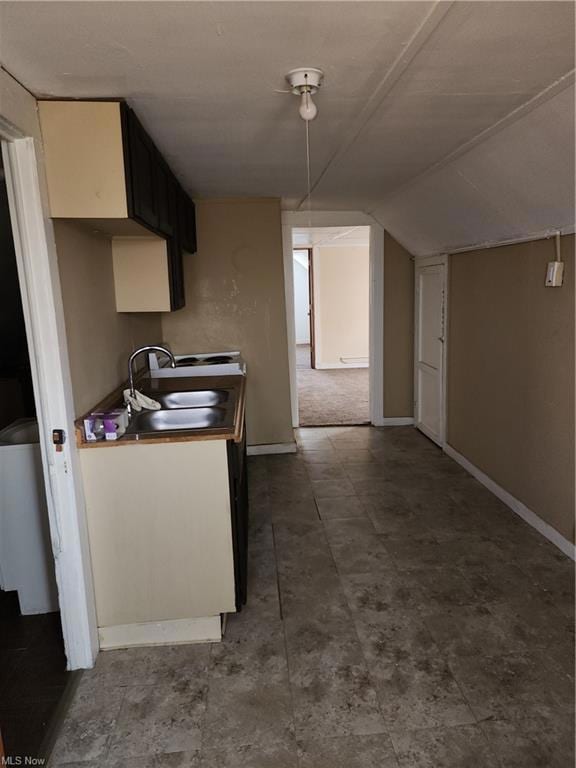 Kitchen featuring sink and tile floors