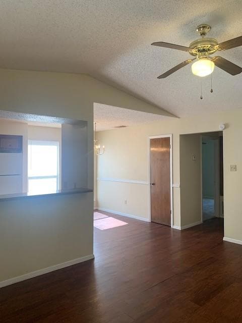 Spare room featuring a textured ceiling, a chande