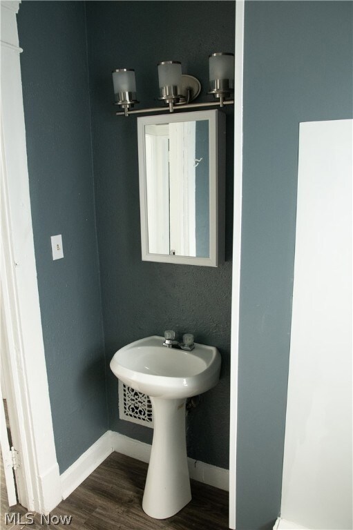 Bathroom with hardwood / wood-style floors