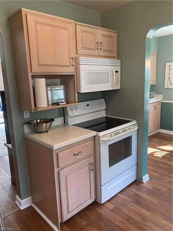 Kitchen featuring white range with electric cooktop, light countertops