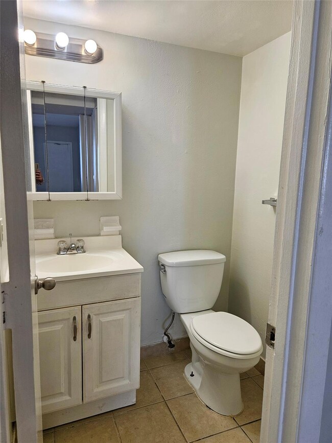 Half bathroom located off main living area offers