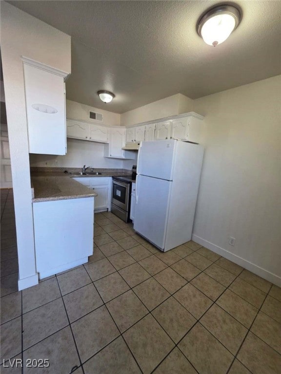 Kitchen with stainless steel range with electric s