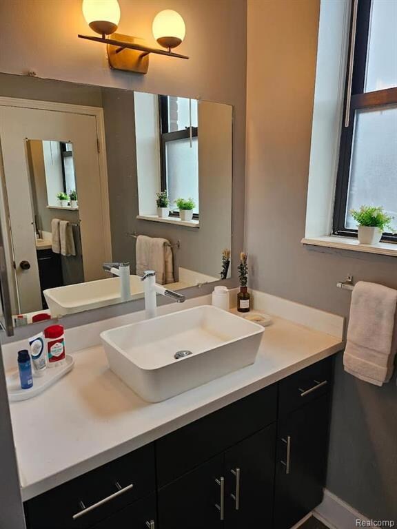 Bathroom with vanity and plenty of natural light
