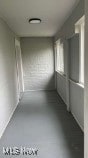 Hallway with concrete flooring