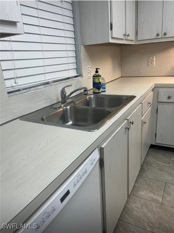 Kitchen with dishwashing machine and light counter