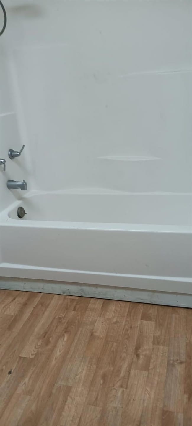 Bathroom featuring tub / shower combination and wo