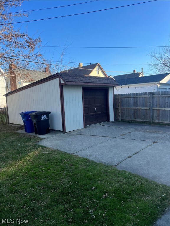 Garage featuring a yard