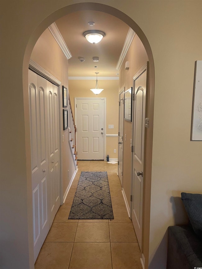 Entryway featuring light tile patterned floors and