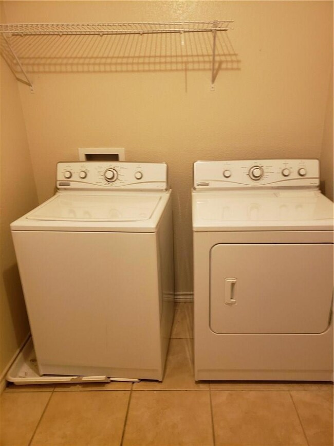 Laundry area with separate washer and dryer and li