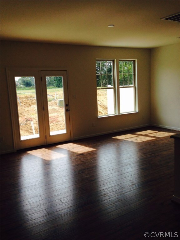 Family Room with Hardwood floors throughout the 1s