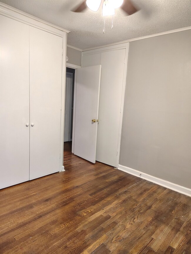 Unfurnished bedroom featuring a textured ceiling, 