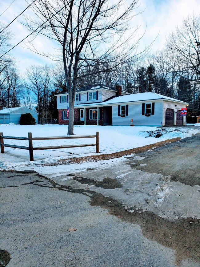 2- Two car garage with parking for 4+ in