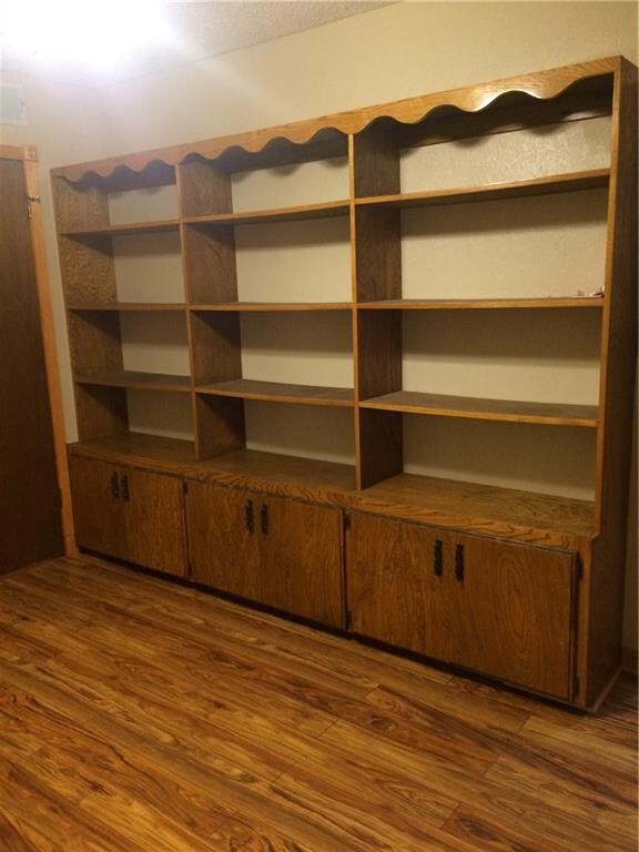 Storage and shelving in downstairs room.