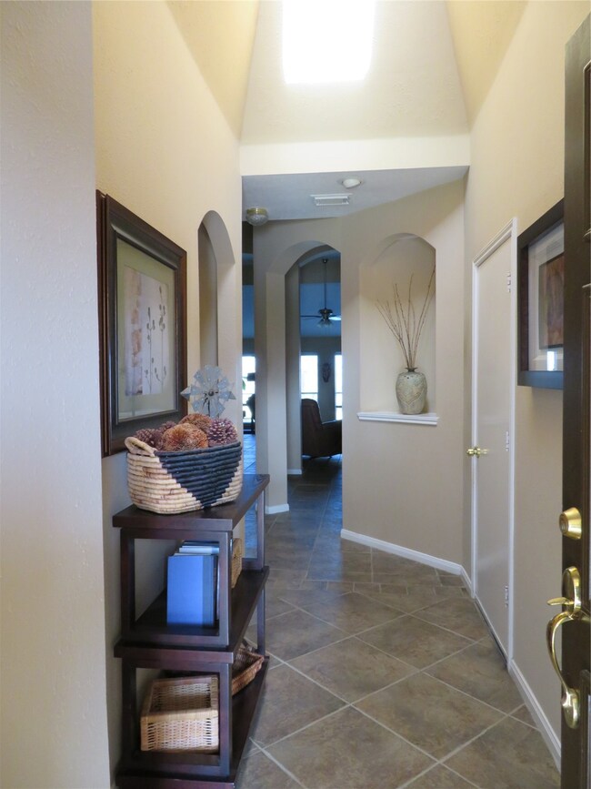 Welcoming foyer with skylight