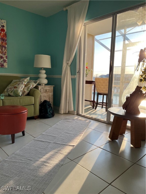 Living room to screened lanai and pool.