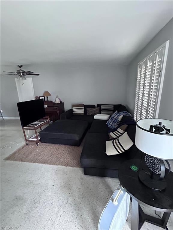 Living room featuring ceiling fan