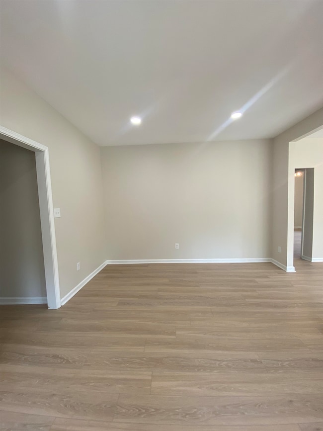 Unfurnished room featuring light wood-style flooring and recessed lighting