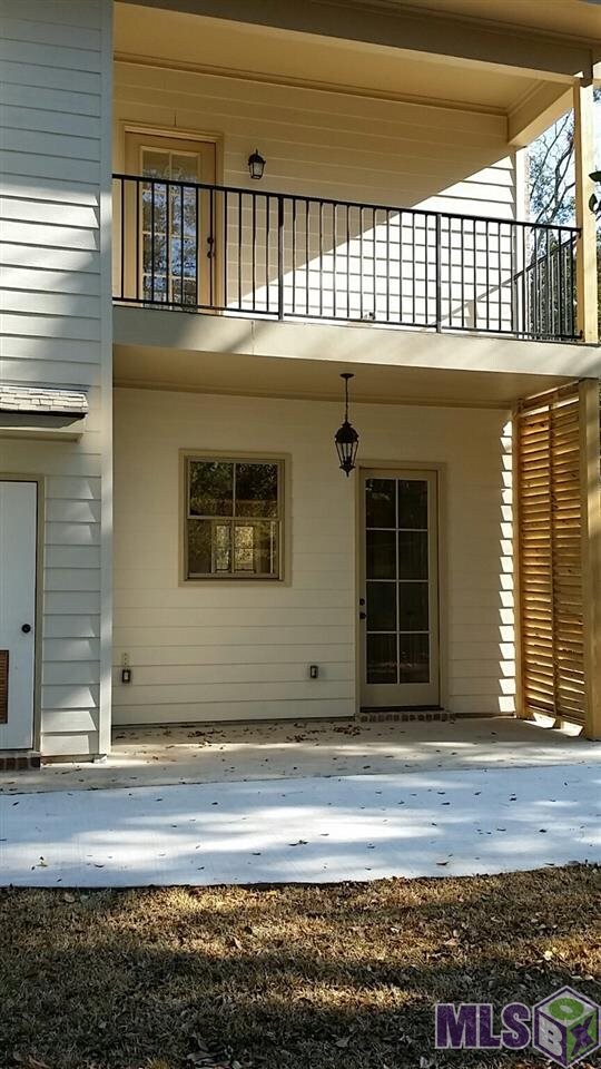 Glimpse of the rear balcony and patio area. There 
