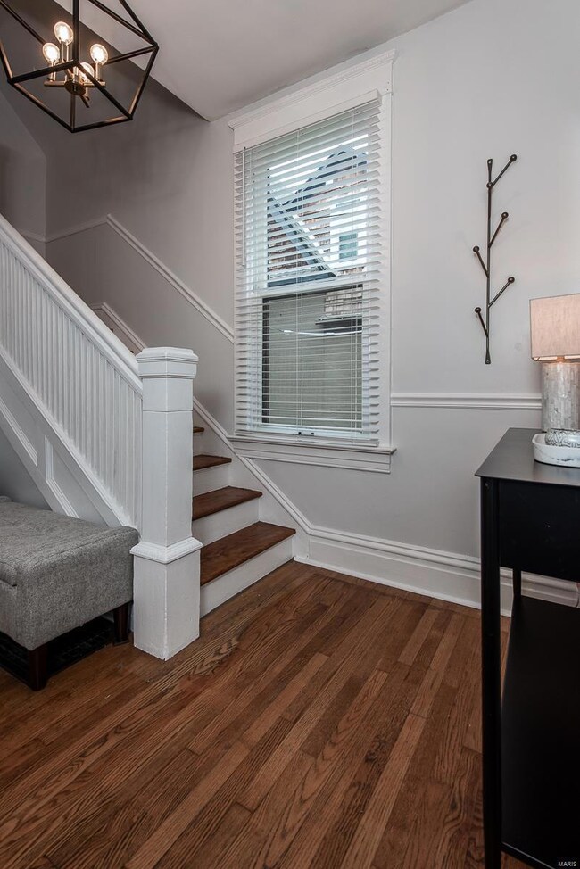 Gleaming hardwood floors and lovely staircase are just the beginning of this story book home!